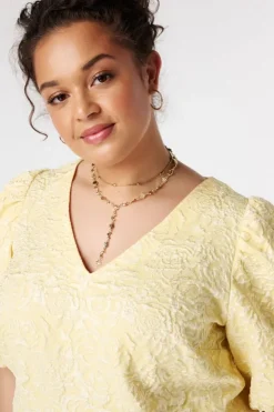 Blouse jacquard à manches bouffantes